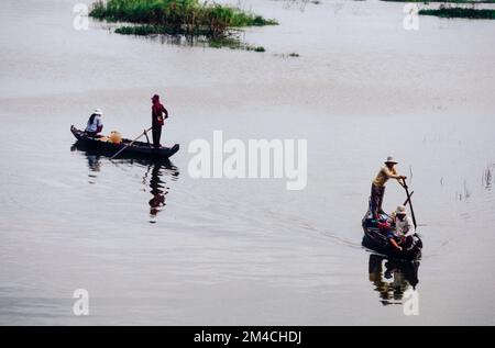 Boots are the way to carry goods across the Tonle Sap River Stock Photo