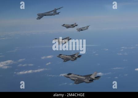 Seoul, South Korea. 20th Dec, 2022. (In this handout photo provided by South Korean Defense Ministry), A U.S. B-52 bomber, C-17 and South Korean Air Force F-35 fighter jets fly over the Korean Peninsula during a joint air drill in South Korea on December 20, 2022. (Handout Photo Korean Defense Ministry via Credit: Sipa USA/Alamy Live News Stock Photo