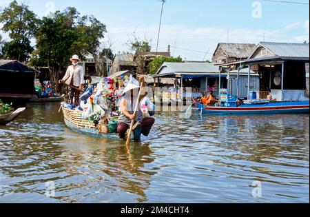 Boots are the way to carry goods across the Tonle Sap River Stock Photo