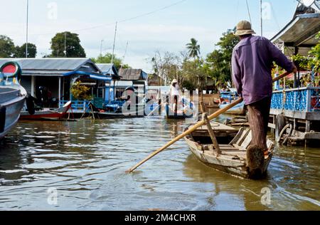 Boots are the way to carry goods across the Tonle Sap River Stock Photo