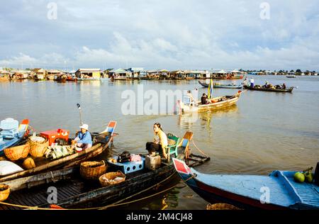 Boots are the way to carry goods across the Tonle Sap River Stock Photo