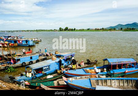 Boots are the way to carry goods across the Tonle Sap River Stock Photo