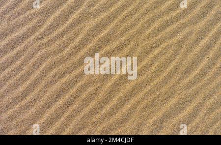 Texture or pattern of rippled sand Stock Photo