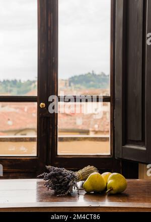 Still Life of Pears and Lavender on Wooden Table in Italy Stock Photo