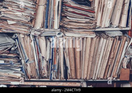 Old paper documents on shelves Stock Photo