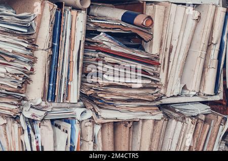Old paper documents on shelves Stock Photo