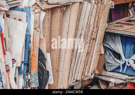 Shelves with old papers in folders, worn out old files. Stock Photo