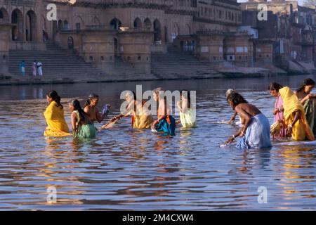 Pilgrims having a bath in the river Yamuna Stock Photo