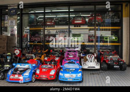 Georgetown, Penang, Malaysia - November 2012: Colorful designer toy cars on display for sale outside a store. Stock Photo