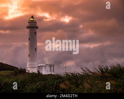 Lighthouse on Green Island at sunset Stock Photo