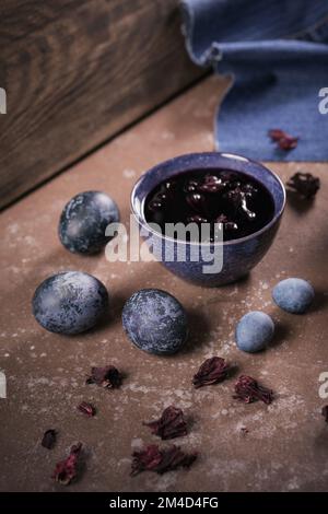 Process of dyeing eggs with natural paints for Easter. Stock Photo
