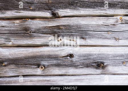 Aged wooden barn beam background with rustic grey wood in Northern Finland Stock Photo