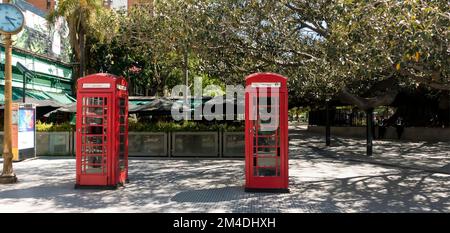 Two formerly British red telephone boxes stand in Recoleta, Buenos Aires, Argentina Stock Photo