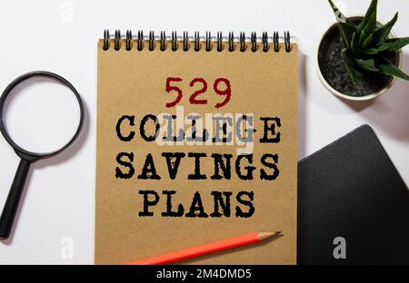 529 College Saving Plans text on the cart. Business and finance concept. Stock Photo