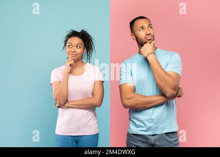 Portrait of thoughtful black man and woman thinking and looking away, touching chin, dreaming or making decision Stock Photo