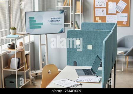 Background image of office workplace cubicle with laptop on desk, copy space Stock Photo