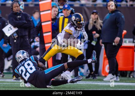December 18, 2022: Pittsburgh Steelers wide receiver Diontae Johnson (18) slips the tackle from Carolina Panthers cornerback Keith Taylor Jr. (28) during the second half of the NFL matchup in Charlotte, NC. (Scott Kinser/Cal Sport Media) Stock Photo