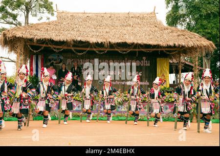 Traditional dance of Akha hill tribe minority in swing festival enjoying music and dancing on Doi Mae Salong. Chiang Rai, Thailand. Stock Photo