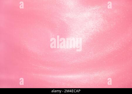 delicate pink background with sequins waves liquid motion Stock Photo