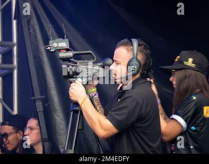 Medellin, Antioquia, Colombia - November 14 2022: Cameraman Holding and Filming with the Camera Stock Photo