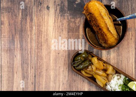 torta de res, typical mexican dish, from jalisco with salty bread, chiles and roasted onion Stock Photo