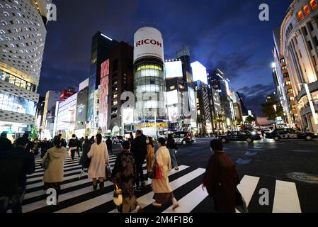 Pedestrians crossing Ginza 4 chome in Ginza, Tokyo, Japan. Stock Photo