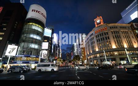 Pedestrians crossing Ginza 4 chome in Ginza, Tokyo, Japan. Stock Photo