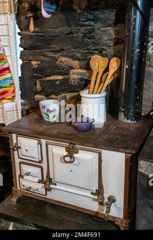 Vintage kitchen with old cast iron wood stove Stock Photo