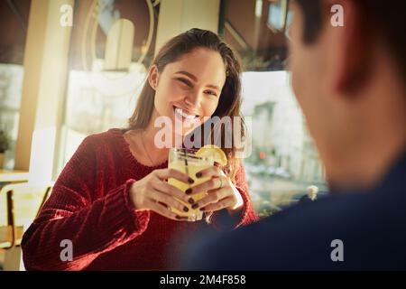 Hes so dreamy...a young man and woman on a romantic date at a coffee shop. Stock Photo