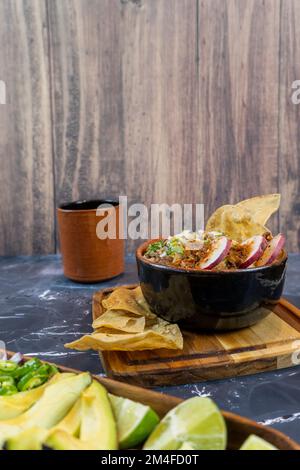 lemon and avocado on a wooden plate to put on meat, traditional mexican food Stock Photo