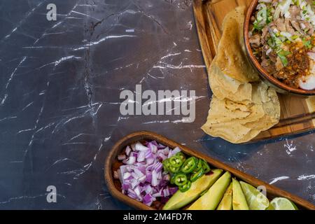 avocado, onion and cilantro, to accompany meat in its juice, typical mexican food Stock Photo