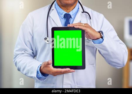 Your health is all that matters. an unrecognizable male doctor holding up a digital tablet in front of him while standing inside of a hospital during Stock Photo
