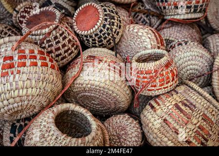 Traditional wicker baskets, exhibited in market shops of the old town Nizwa. Oman. Arabian Peninsula. Stock Photo