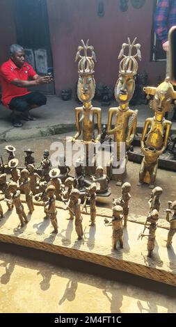 Benin City, Benin. 19th Dec, 2022. Freshly cast Benin bronze figures stand in the guild alley of bronze and brass sculptors in Benin City while Minister of State for Culture Roth is visiting. With the Benin bronzes, Germany is returning a valuable cultural treasure from colonial times to Nigeria for the first time. Credit: Alexandre Callegaro/dpa/Alamy Live News Stock Photo