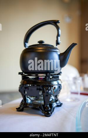 Close-up of an iron kettle for drinking tea Stock Photo