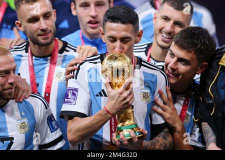 LUSAIL CITY, QATAR - DECEMBER 18:  FIFA World Cup Qatar 2022 Final match between Argentina and France at Lusail Stadium on December 18, 2022 in Lusail City, Qatar. Fussball Weltmeisterschaft Finale Argentinien - Frankreich  Angel Di Maria of Argentina  celebrate with the World Cup Trophy following their side victory after  FIFA WM  2022 in Qatar Katar FIFA Football World Cup 2022 © diebilderwelt / Alamy Stock Stock Photo