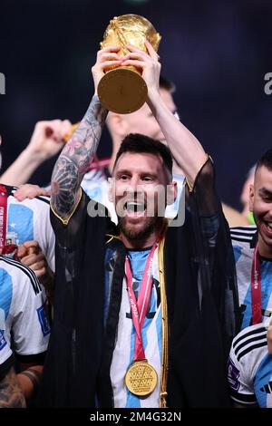 LUSAIL CITY, QATAR - DECEMBER 18:  FIFA World Cup Qatar 2022 Final match between Argentina and France at Lusail Stadium on December 18, 2022 in Lusail City, Qatar. Fussball Weltmeisterschaft Finale Argentinien - Frankreich  Lionel Messi of Argentina celebrate with the World Cup Trophy following their side victory after  FIFA WM  2022 in Qatar Katar FIFA Football World Cup 2022 © diebilderwelt / Alamy Stock Stock Photo