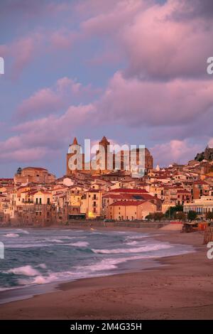 Cefalu, Sicily, Italy. Cityscape image if coastal town Cefalu in Sicily at dramatic sunset. Stock Photo