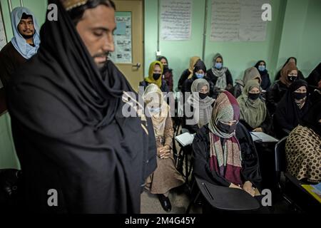 Kabul, Afghanistan. 17th Nov, 2022. Taliban standing in a classroom of a police barracks where women are being trained as police officers. With their seizure of power in August 2021, the Taliban massively restricted women's rights. Girls' schools starting in seventh grade have been closed in much of the country, and women have largely been pushed out of the workforce. In December, the Taliban also announced it would ban women from entering universities. (to dpa 'Afghanistan's women: One setback after another') Credit: Oliver Weiken/dpa/Alamy Live News Stock Photo