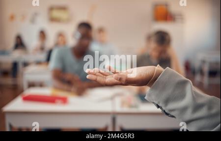 Hand, education and study with a teacher and students in a classroom for a lesson on growth or development. University, learning and higher education Stock Photo