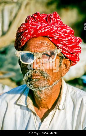 Old man with glasses in the streets of Jaisalmer. Stock Photo