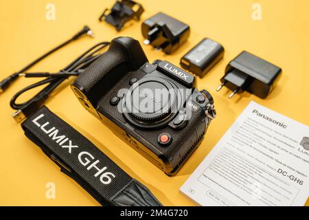 Paris, France - Nov 20, 2022: Unboxing flat lay overhead lateral view of Panasonic Lumix DMC-GH6 Micro Four Thirds System digital still video camera with 5k 10 bit Video recording internal capability Stock Photo