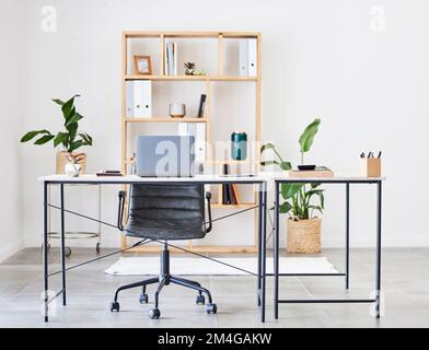 Empty office, table or desk in a home office interior or office desk with pens, plants or stationery for productivity. Furniture, chair or modern Stock Photo