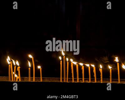 burning candles in a church Stock Photo