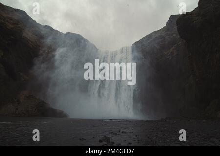 Large waterfall on cliff landscape photo Stock Photo
