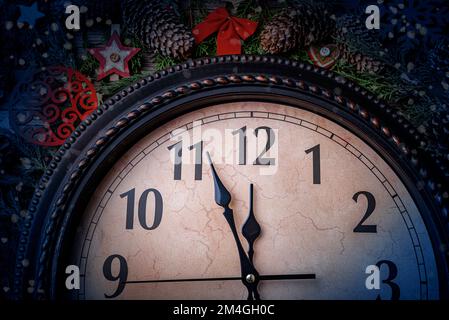The old clock shows five minutes to midnight. New Year - concept. Stock Photo