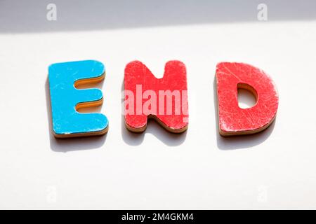 wooden letters in red and blue forming the word End Stock Photo