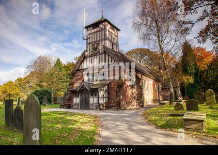 Stunning autumn colour St Mary and All Saints church and churchyard in the picturesque village of Whitmore in Staffordshre late October Stock Photo