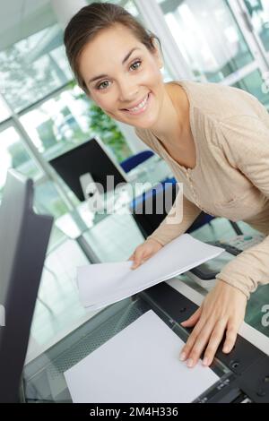 happy business lady using photocopier in office Stock Photo