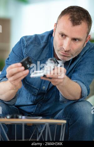 client getting securty camera installed at home Stock Photo